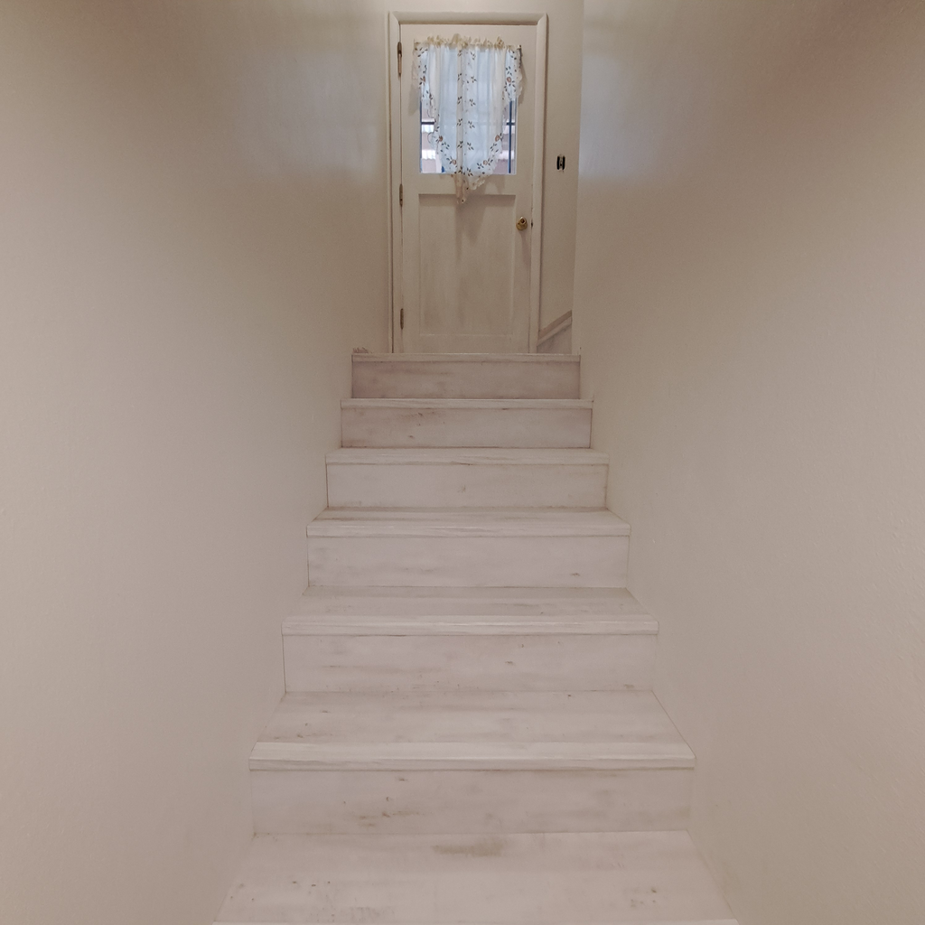 Stair renovation finalized 0<br />laminate vinyl plank flooring installation in Seattle hold downstairs with the staircase