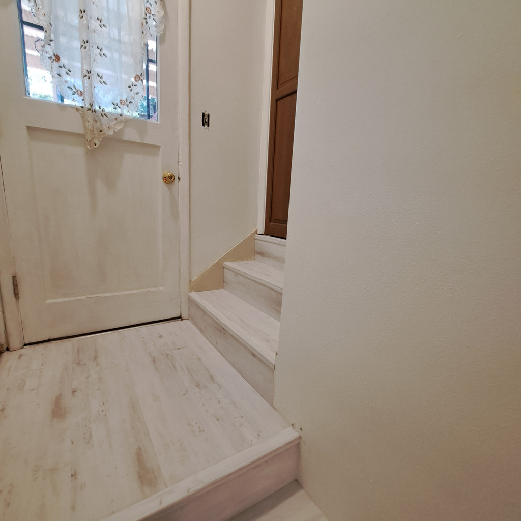 Stair renovation finalized 0<br />laminate vinyl plank flooring installation in Seattle hold downstairs with the staircase